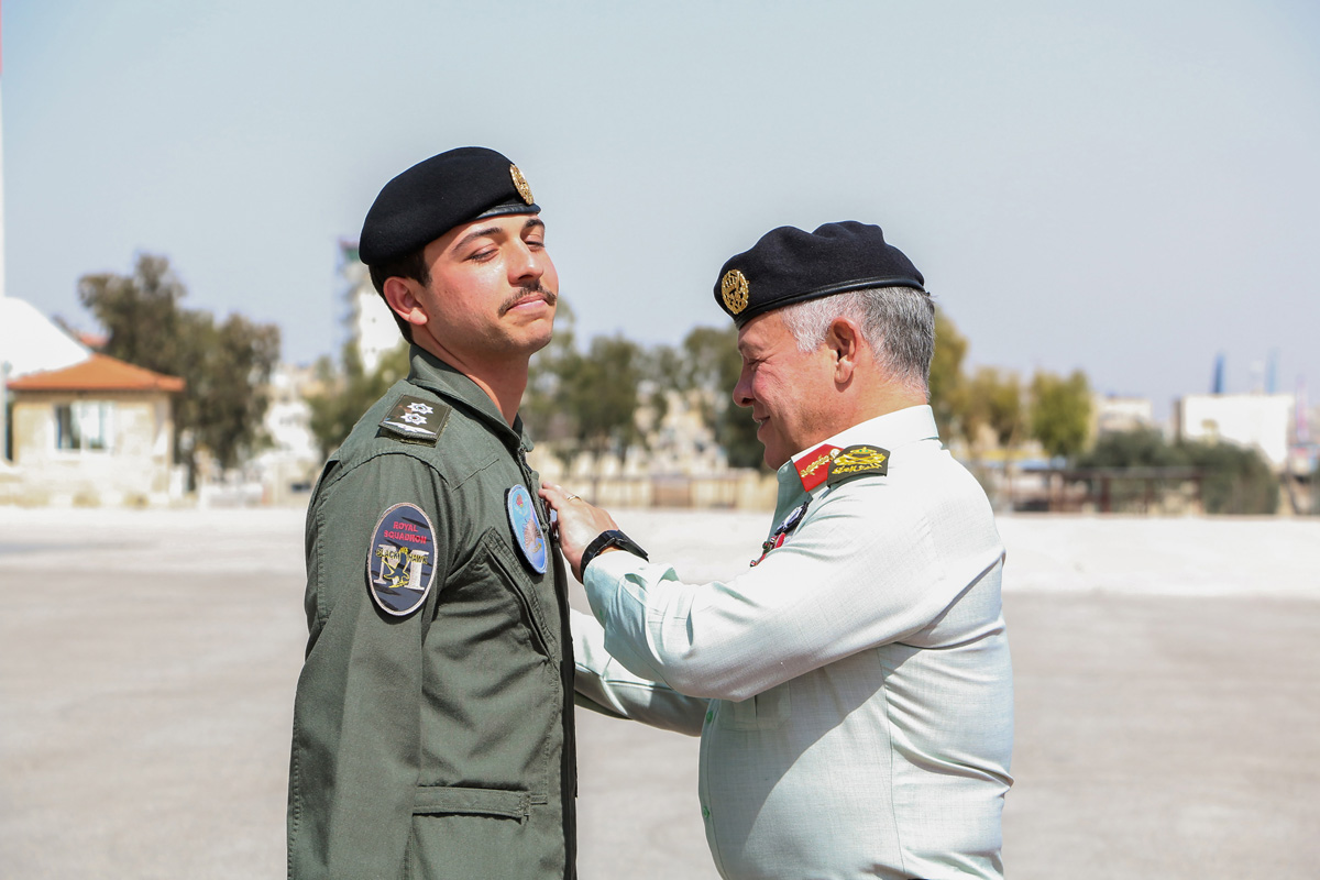 King presents Crown Prince with wings upon completing pilot training