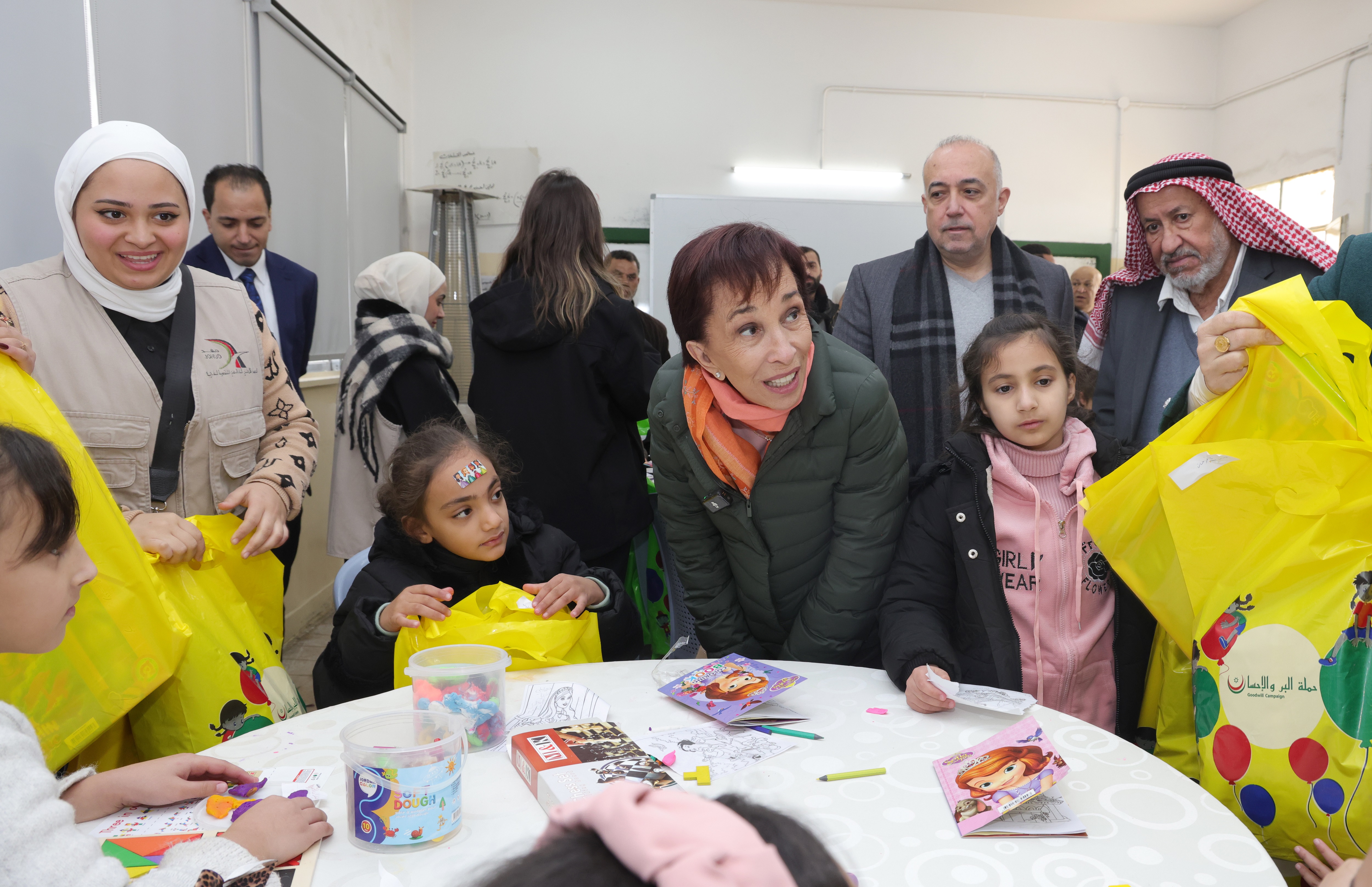 Princess Basma hands charity aid to needy families in Amman neighborhoods